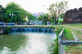 Chiang Mai, Thailand - January 11, 2023 : Ancient brick wall and overflow weir